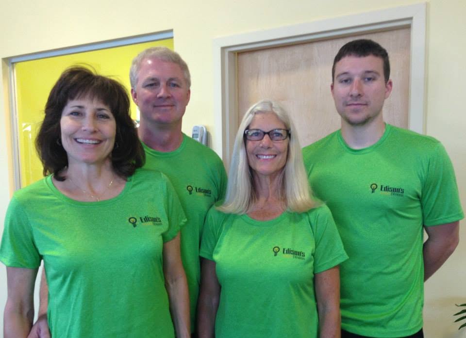The Edison's Smart Fitness team in green staff shirts.